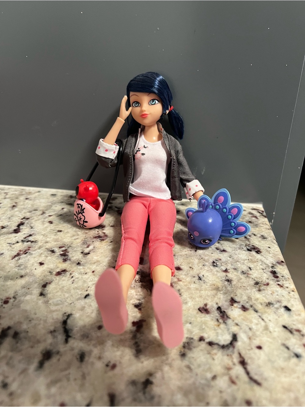Blue-Haired Fashion Doll with Pink Outfit and Purple Pet